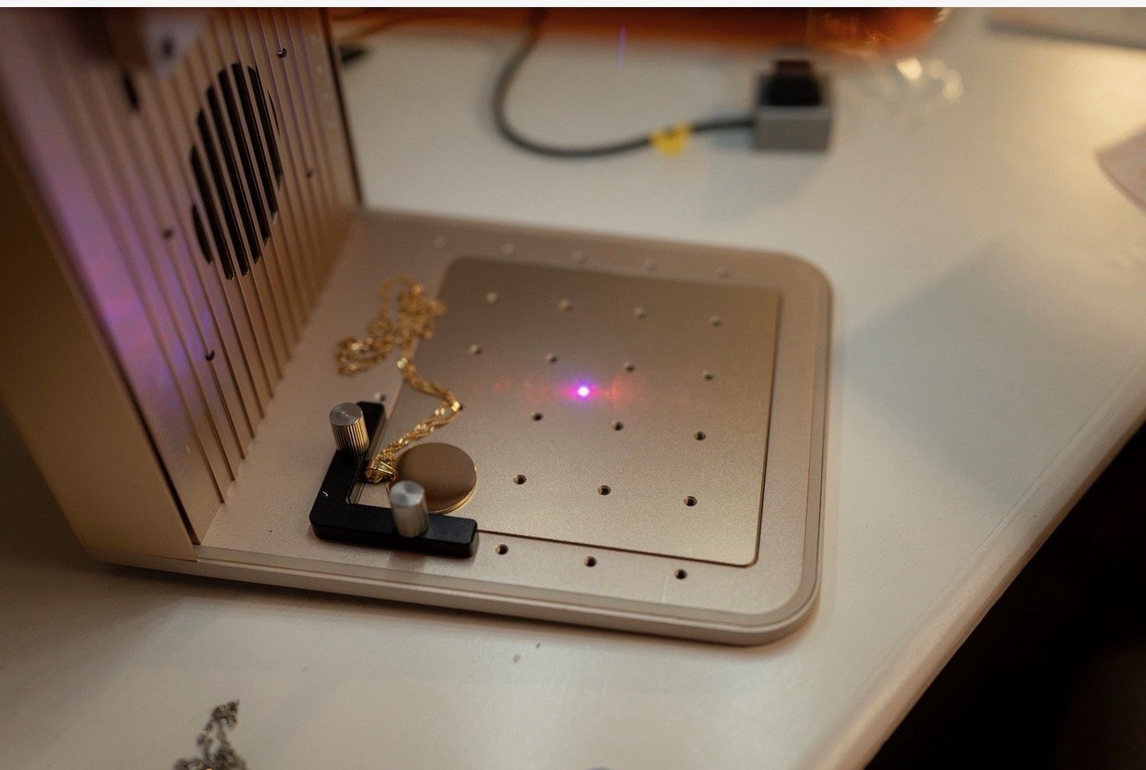 Jewelry being engraved at Amoré Engraving Bar